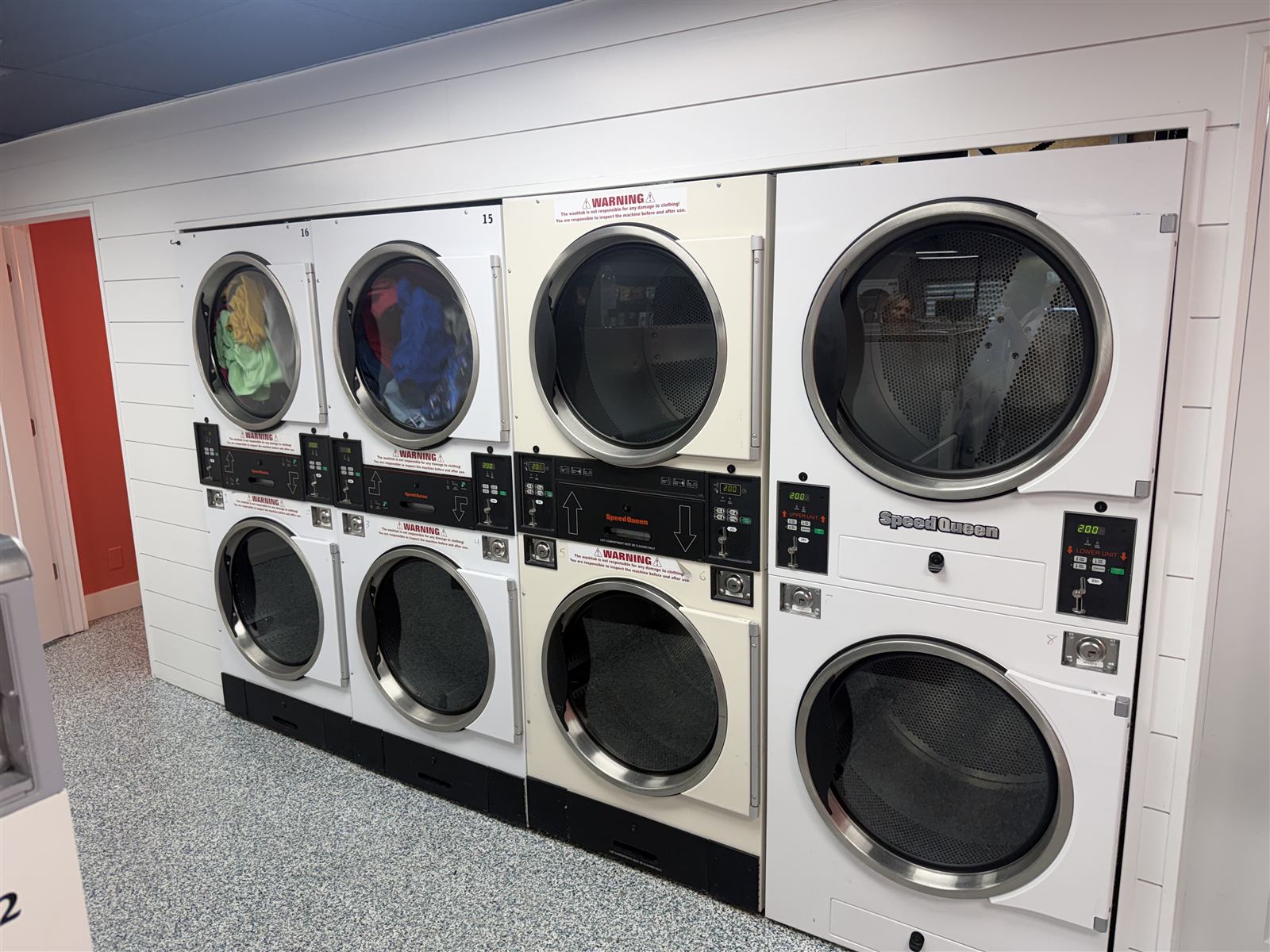A wall of stacked Speed Queen dryers at the Blair laundromat